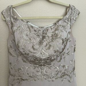 Beautiful dress! Professionally hemmed and bra cups inserted.